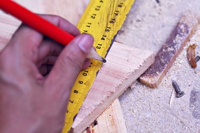 Cropped image of carpenter working in carpentry workshop