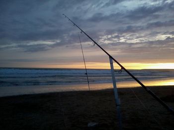 Scenic view of beach against sky during sunset