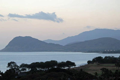 Scenic view of sea with mountains in background