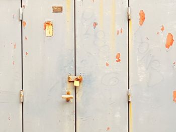 Padlock on damaged door