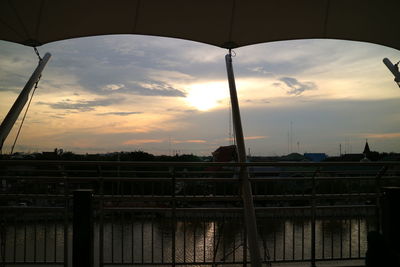 Built structure against cloudy sky at sunset