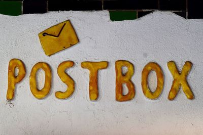 Close-up of text on white wall