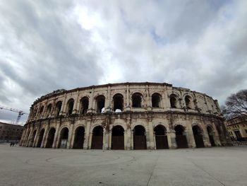 Old ruins of building against cloudy sky