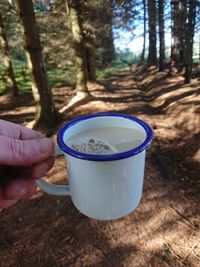 Hand holding coffee cup