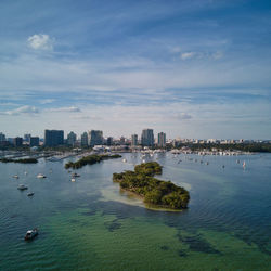 Scenic view of sea and buildings against sky