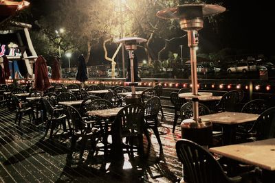 Empty chairs and tables in restaurant