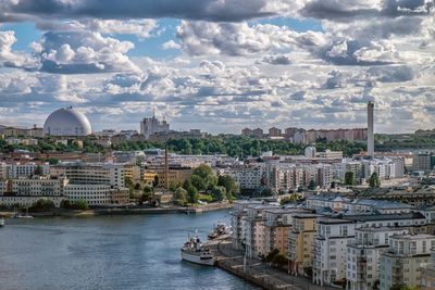 View of city against cloudy sky