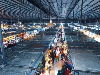 High angle view of people at illuminated market stall