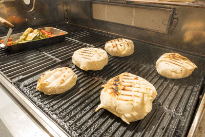 High angle view of meat on barbecue grill