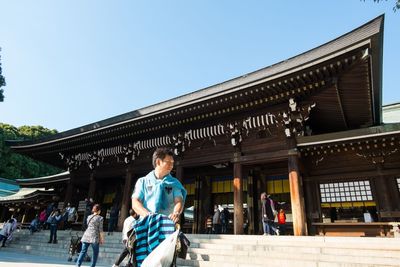 Woman standing in front of building