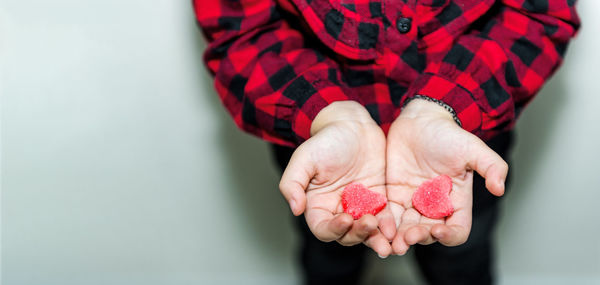 Close-up of hand holding strawberries
