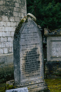 Text on stone at cemetery