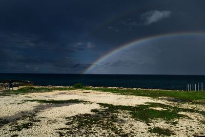 Scenic view of rainbow over sea