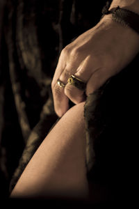 Close-up of young woman holding hands