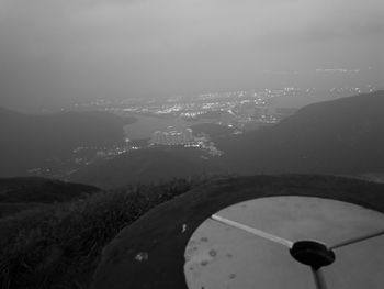 Aerial view of city by sea against sky