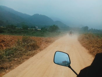 Dirt road in fog