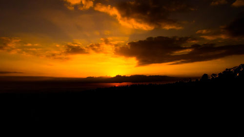 Scenic view of silhouette landscape against sky during sunset