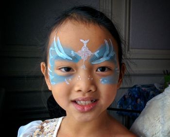 Close-up portrait of asian girl in face paint