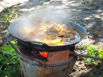 High angle view of fire on barbecue grill