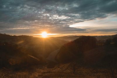 Scenic view of landscape against sky during sunset