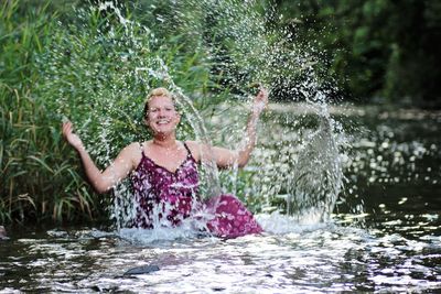 Woman enjoying in river