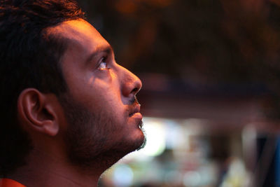 Close-up portrait of man looking away