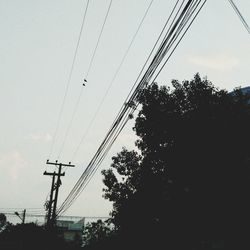 Low angle view of electricity pylon