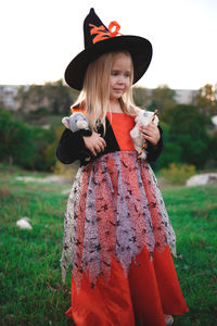 Full length of girl standing on field