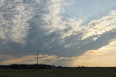 Scenic view of field against sky during sunset