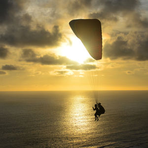 Sunset  and paragliding