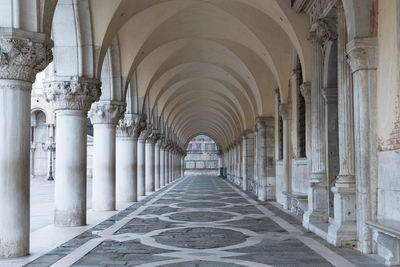 Ornate venetian arched passageway with symmetrical tiling