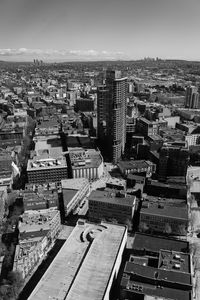 High angle view of city buildings against sky