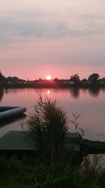 Scenic view of lake at sunset