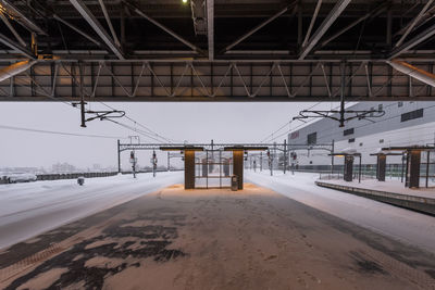 Snow covered railroad station platform during winter