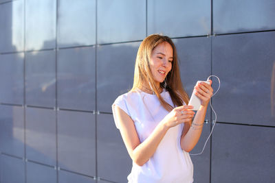 Young woman using mobile phone