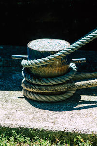 Close-up of rope tied on wood