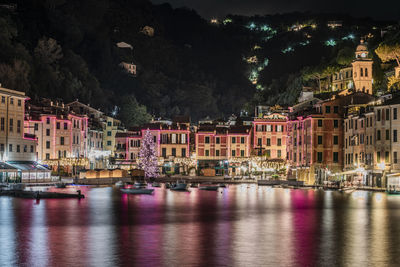 Illuminated buildings in city at night