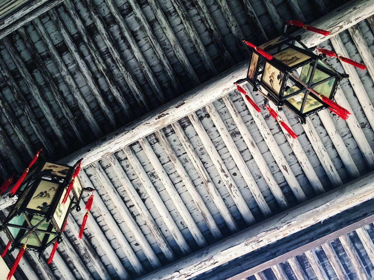 wood - material, high angle view, red, wooden, no people, day, metal, outdoors, built structure, wood, in a row, railing, close-up, roof, architecture, metallic, protection, old, sunlight, steps