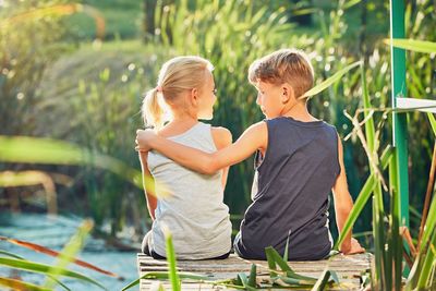 Siblings standing outdoors