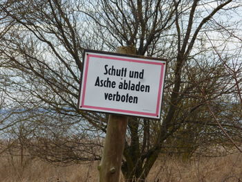 Information sign on tree trunk