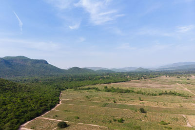 Scenic view of agricultural field against sky