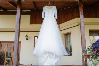 Low angle view of white hanging outside building