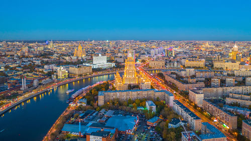 High angle view of illuminated buildings in city