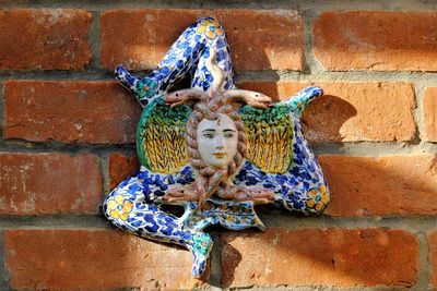 Close-up of statue against wall