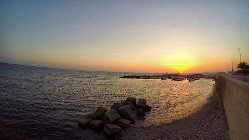 Scenic view of sea at sunset