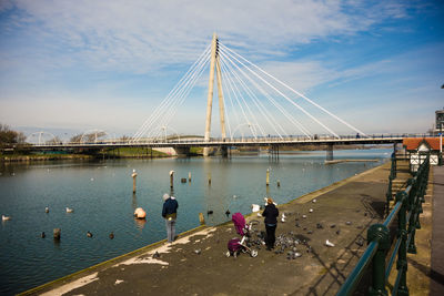 Marine way bridge over river against sky