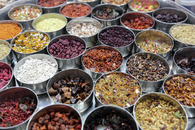 Different spices and herbs in metal bowls on a street market in kolkata, india