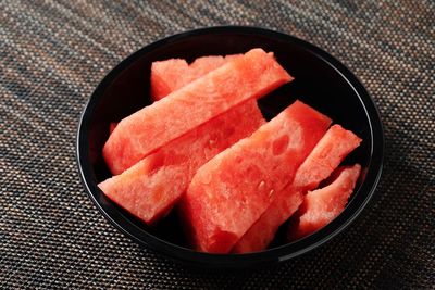 High angle view of orange slices in bowl on table