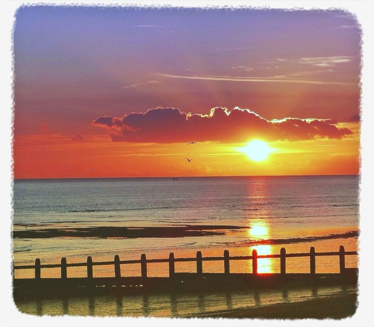 sunset, water, sea, sun, scenics, horizon over water, sky, tranquil scene, beauty in nature, orange color, tranquility, transfer print, reflection, idyllic, nature, auto post production filter, railing, cloud - sky, sunlight, outdoors