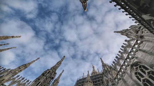 Low angle view of statue against cloudy sky